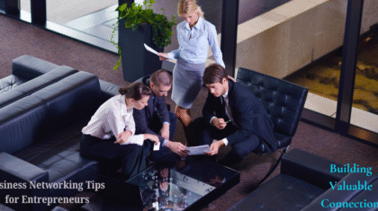 A group of four business professionals are gathered around a table in a modern office setting, discussing documents. The text "Business Networking Tips for Entrepreneurs" and "Building Valuable Connections" is visible in the image.