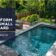 A small backyard with a sleek plunge pool surrounded by a paved deck, lush greenery, and outdoor furniture, creating a tranquil and inviting outdoor space.