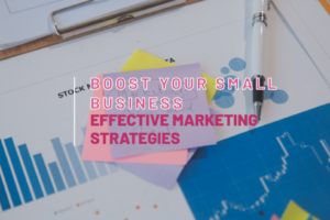 A stack of sticky notes with the text "Boost Your Small Business: Effective Marketing Strategies" on top of charts and graphs.