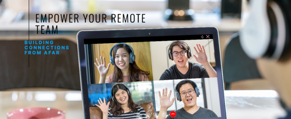 A laptop screen showing a virtual meeting with four people waving, each wearing headphones, promoting remote teamwork. The text on the screen reads, "Empower Your Remote Team: Building Connections from Afar."