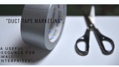 A roll of duct tape and a pair of scissors on a white surface with the text "DUCT TAPE MARKETING", "A USEFUL RESOURCE FOR SMALL ENTERPRISES".
